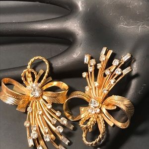 Pair of Sarah Coventry gold tone clip on earrings with rhinestones